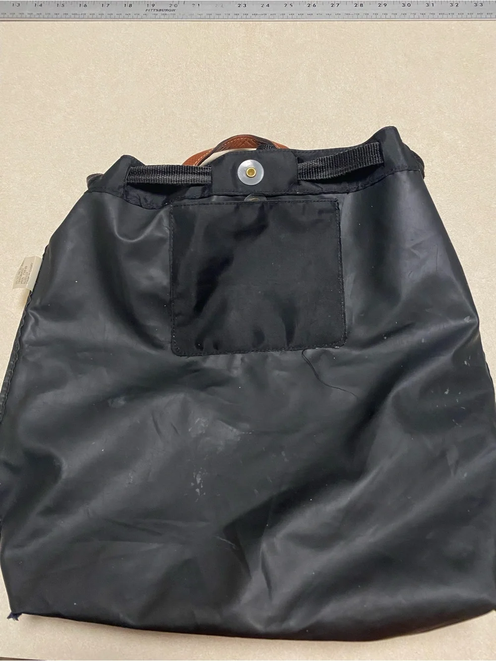 Longchamp Le Pliage Drawstring backpack Black Tan Leather 2 Way Folding NAM LIG